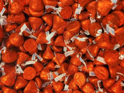 Silver foil wraps the sweet, dark peaks wait inside, grit meets the plume