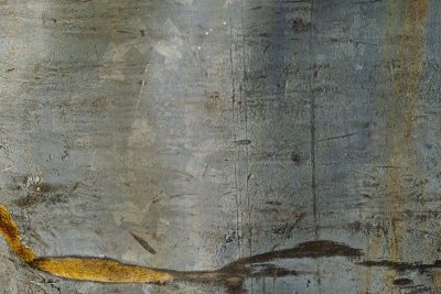 Cold steel bears the scars, golden rust bleeds from the edge, time marks every inch