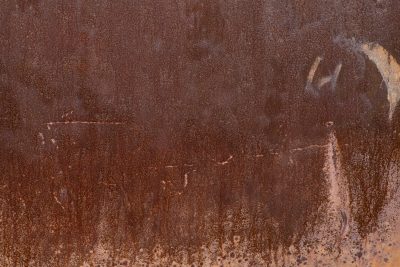 Red iron decays, water stains the heavy steel, years bleed through the dark