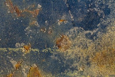 Dark paint starts to peel, orange rust eats through the steel, metal turns to dust