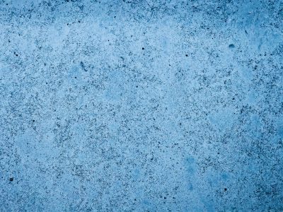 Speckled blue metallic, dark pits scar the faded coat, time wears down the gloss.