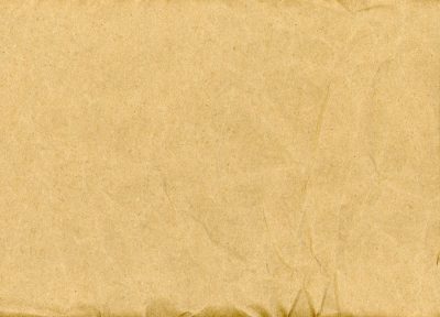 Tan skin holds the age, faded marks trace the field, grit meets the old year