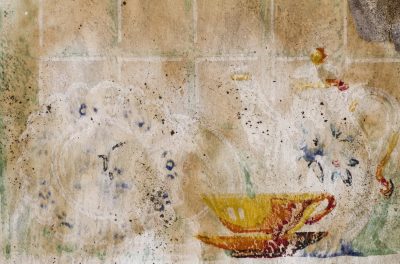 Tea set on the tan, yellow cup meets blue and white, grit marks the old page