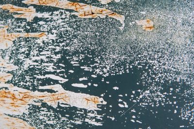 Teal skin meets the oxidation, orange rust veins bleed, grit holds the finish