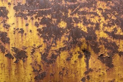 Teal skin meets the rust, orange veins bleed through the blue, grit holds the finish