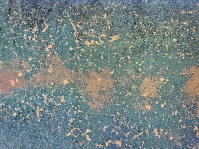 Teal skin turns to gold, orange rust blooms on the blue, steel wears thin and old