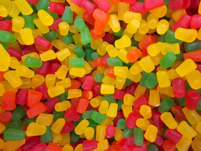 White drifts hold the light, blue shadows carve the field, cold claims the depth