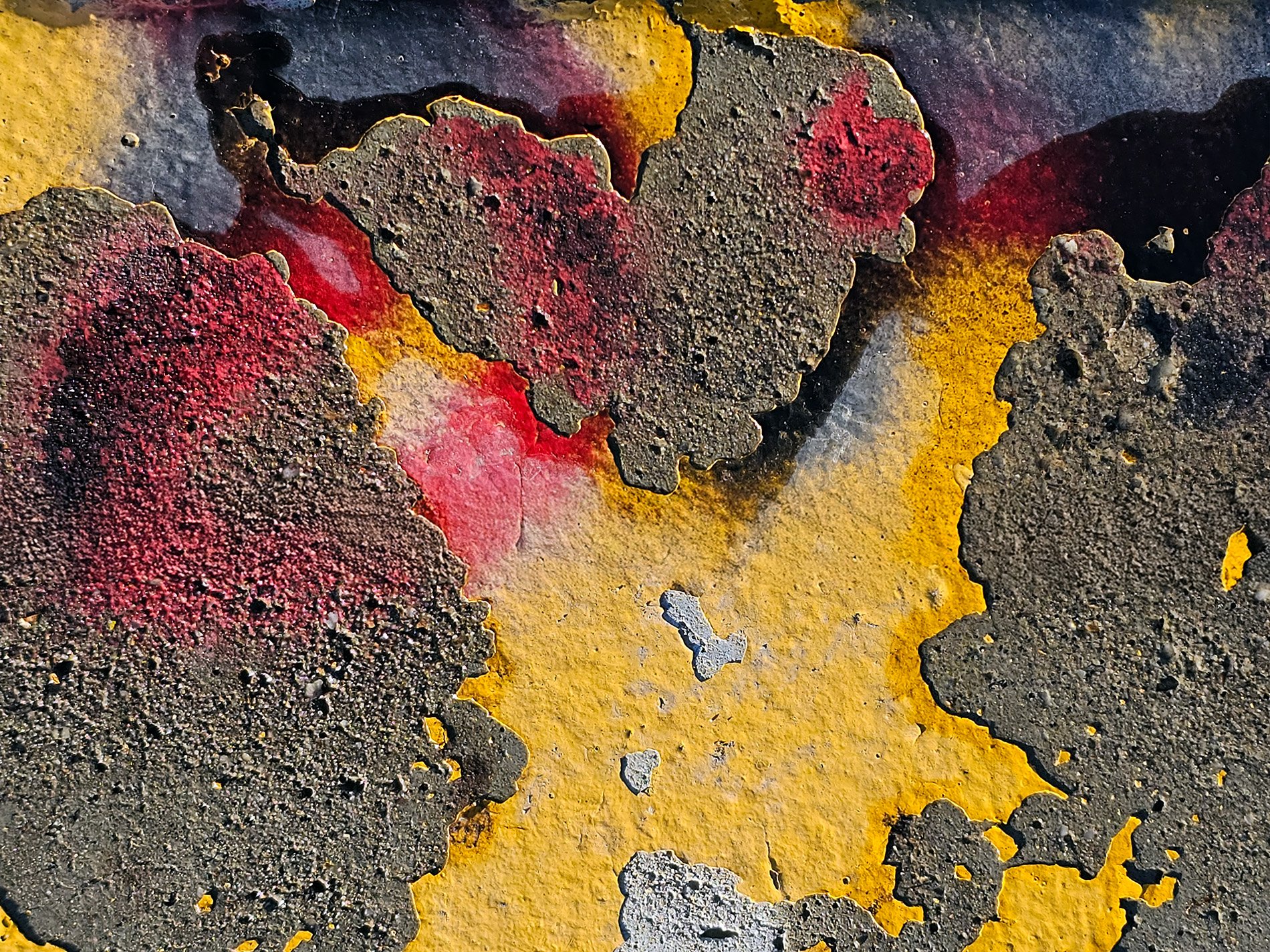 Yellow skin peels back, red stains bleed on rough concrete, time breaks the surface.