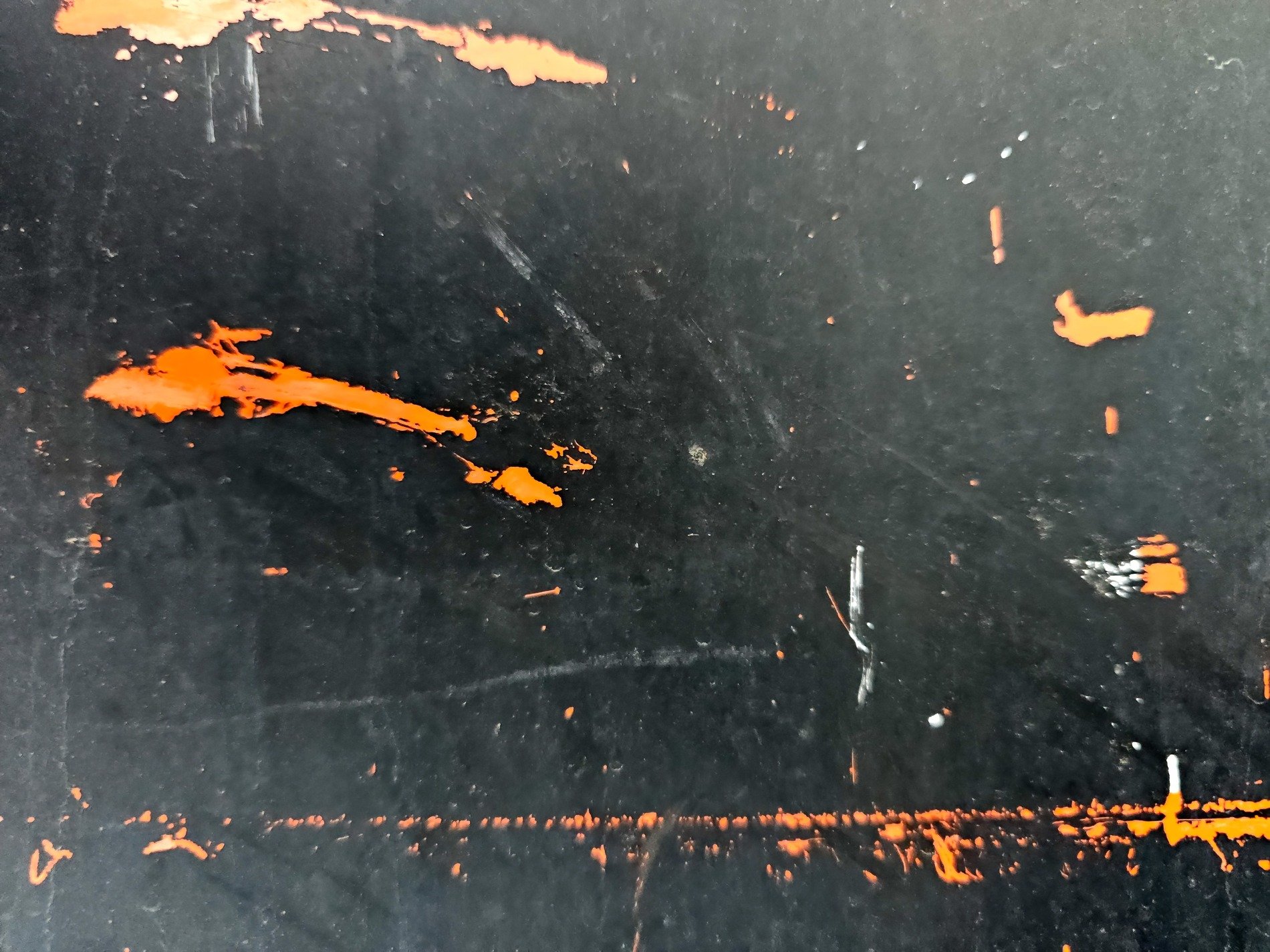 Black steel wears its scars, orange flares break through the dark, time reveals the core