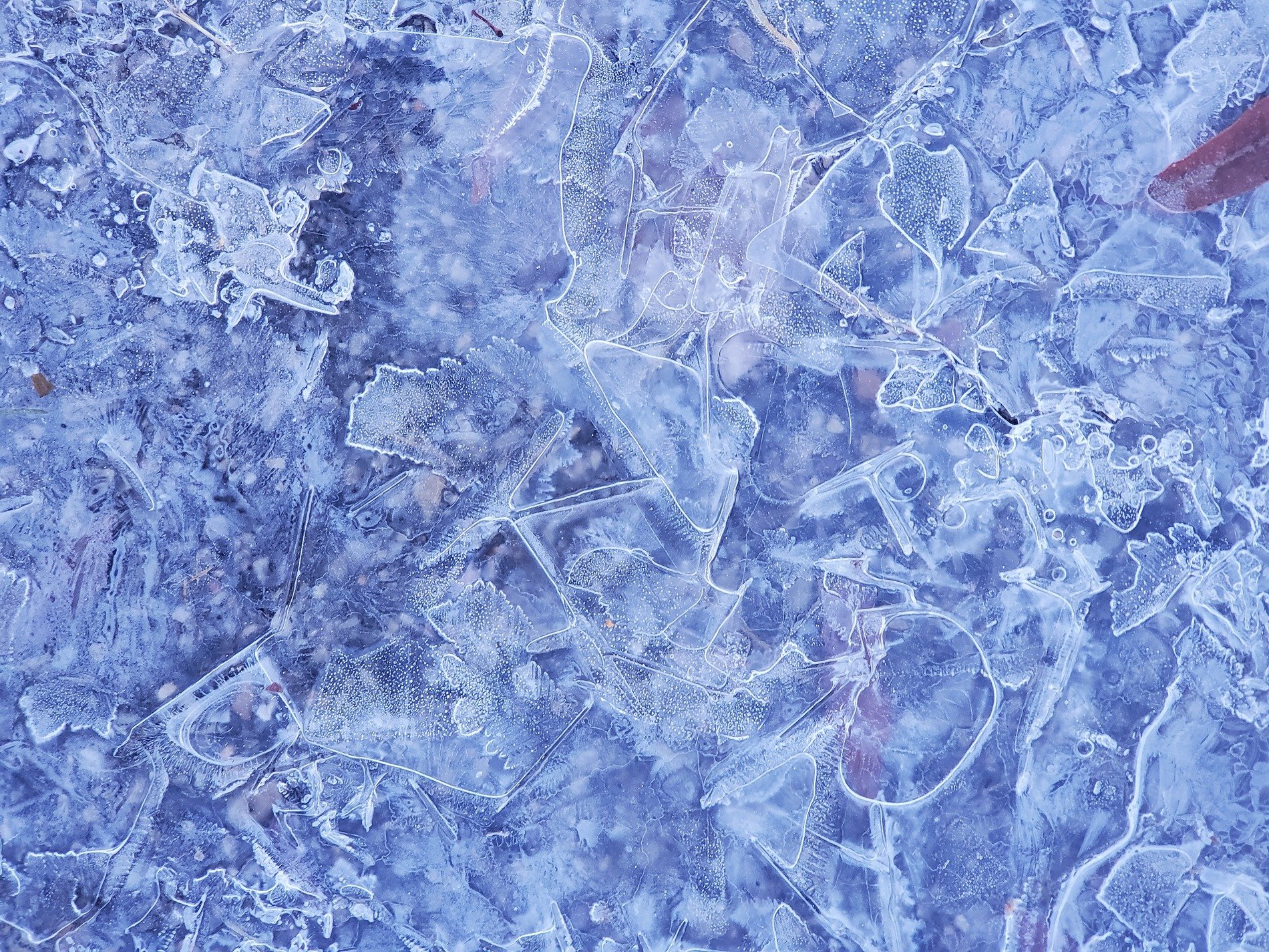 Blue crystals lock tight, jagged ice meets the light, cold paths show the way