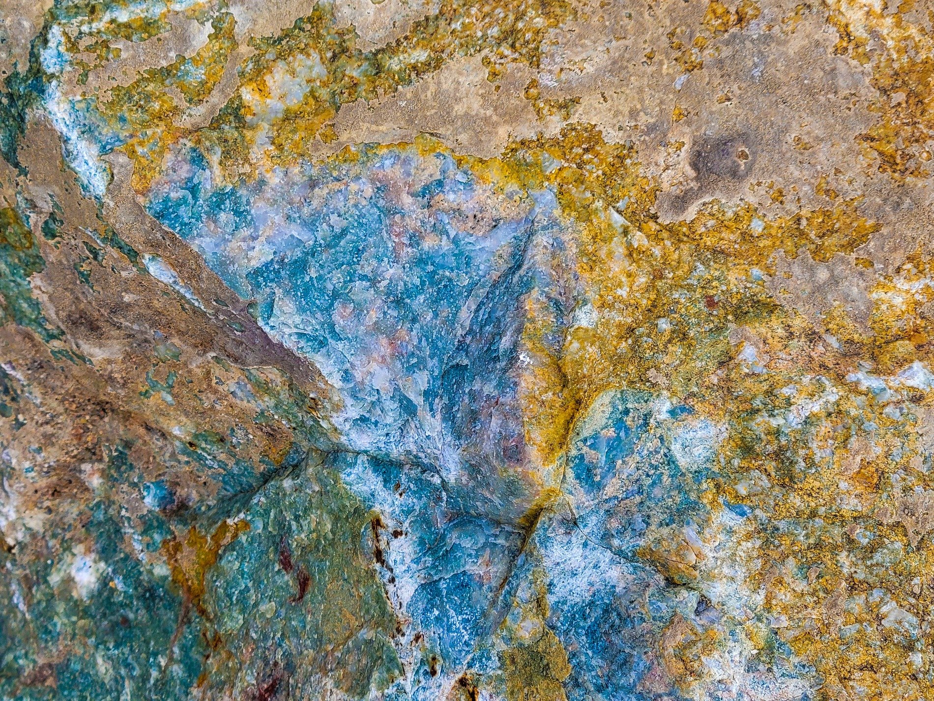 Blue fields meet the tan, jagged mineral traces, grit holds the finish