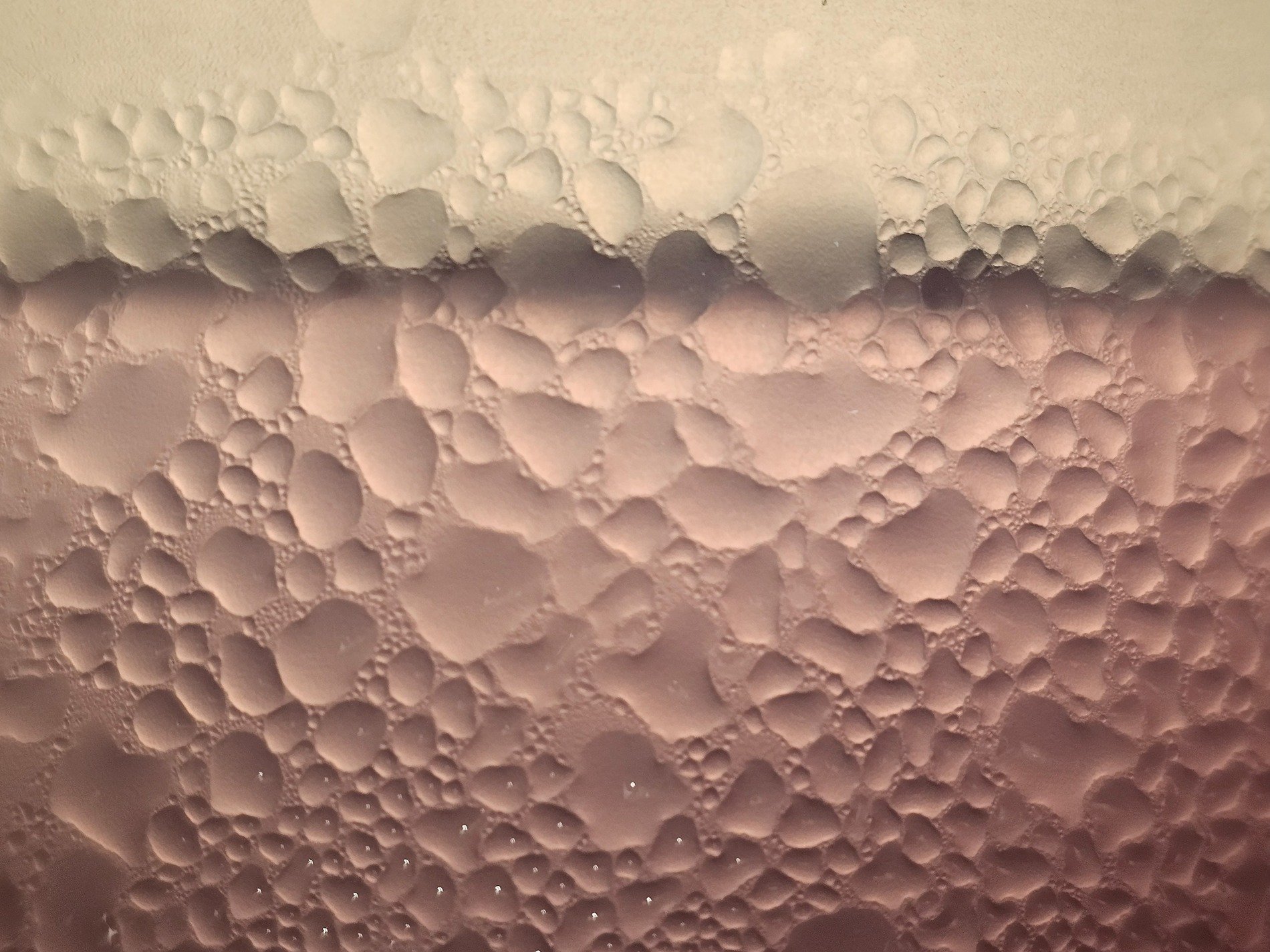 Blue frost meets the pane, crystalline paths trace the field, cold light holds the grit