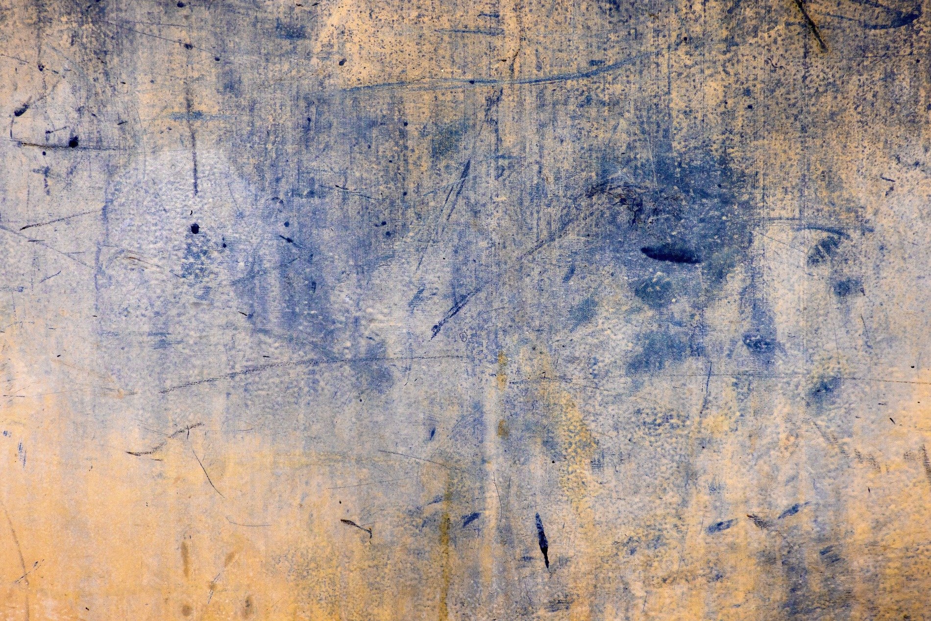 Indigo ink fades, scratches mar the yellowed steel, time leaves weary marks