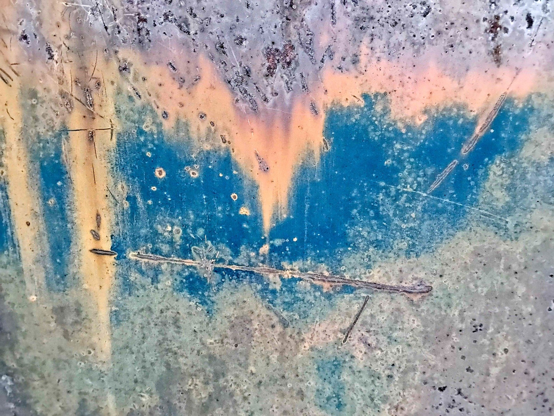 Blue paint holds the fields, orange rust claims the heavy, years leave a deep trace