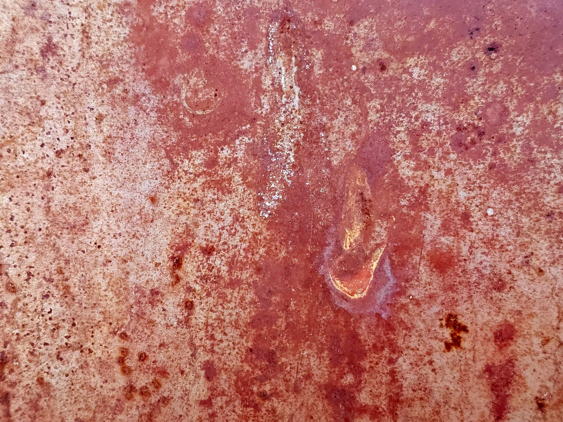 Iron turns to rust, warm red dust coats the surface, time eats the metal