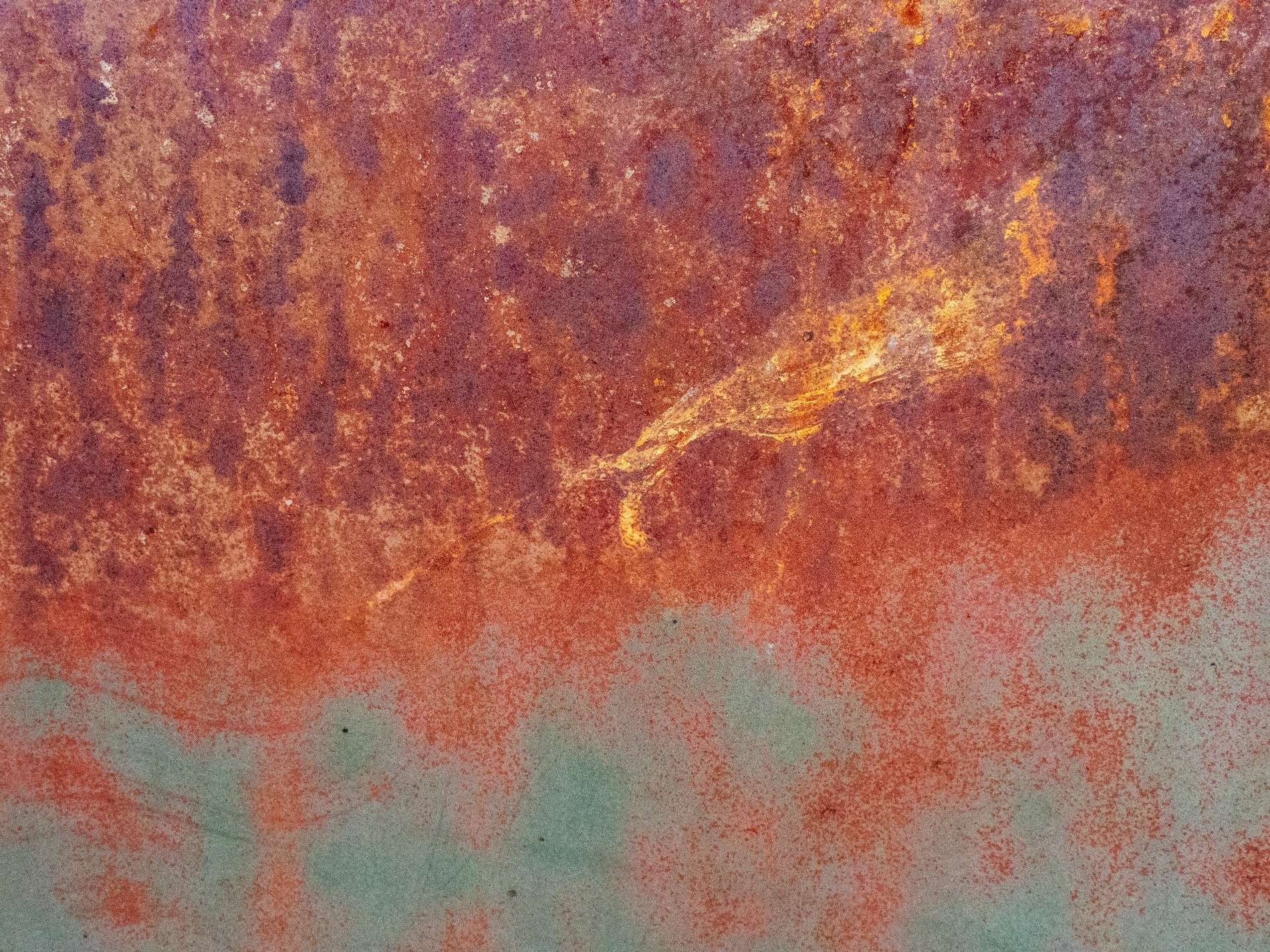 Blue skin peels away, jagged edges meet the light, grit marks the finish