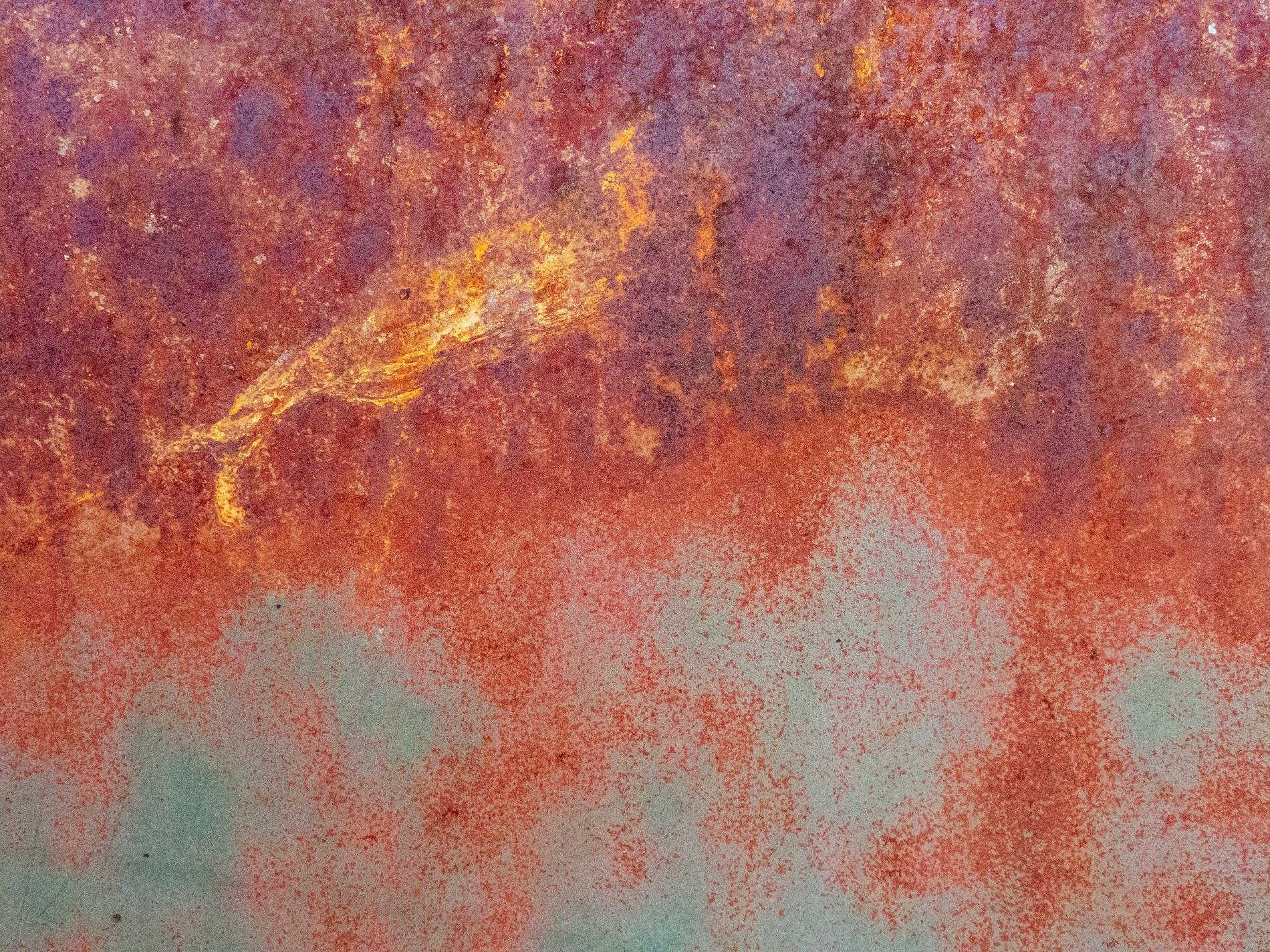 Blue skin peels away, jagged edges meet the light, light catches the grit