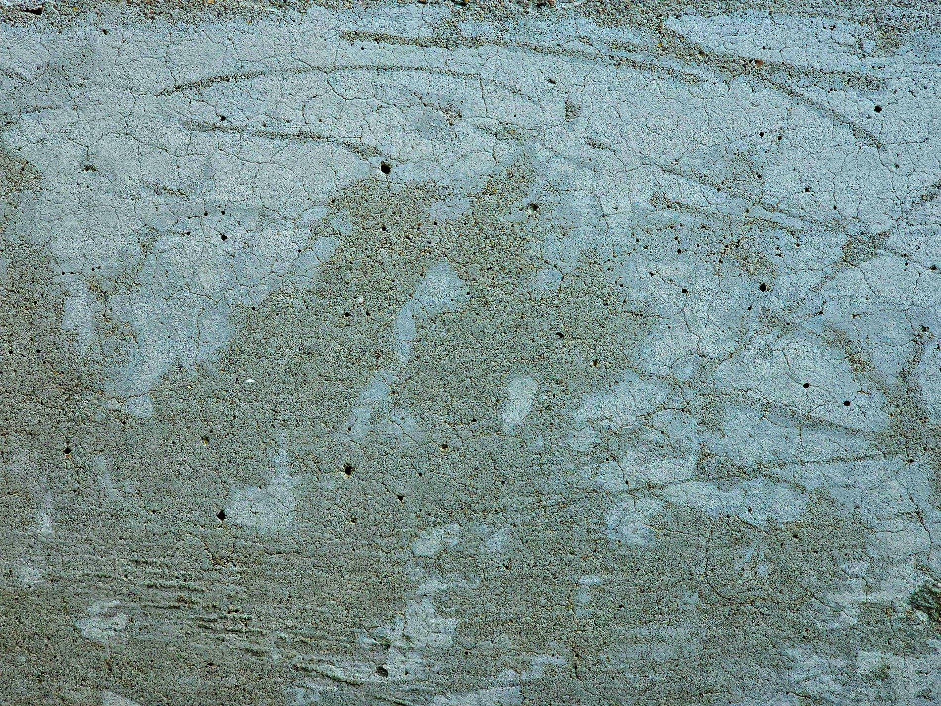 Blue stone holds the cold, thin cracks web across the face, time carves out the marks