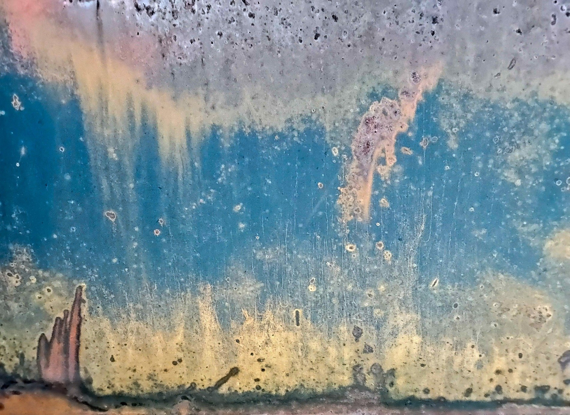 Blue streaks flow deep, vertical paths trace the skin, grit marks the finish