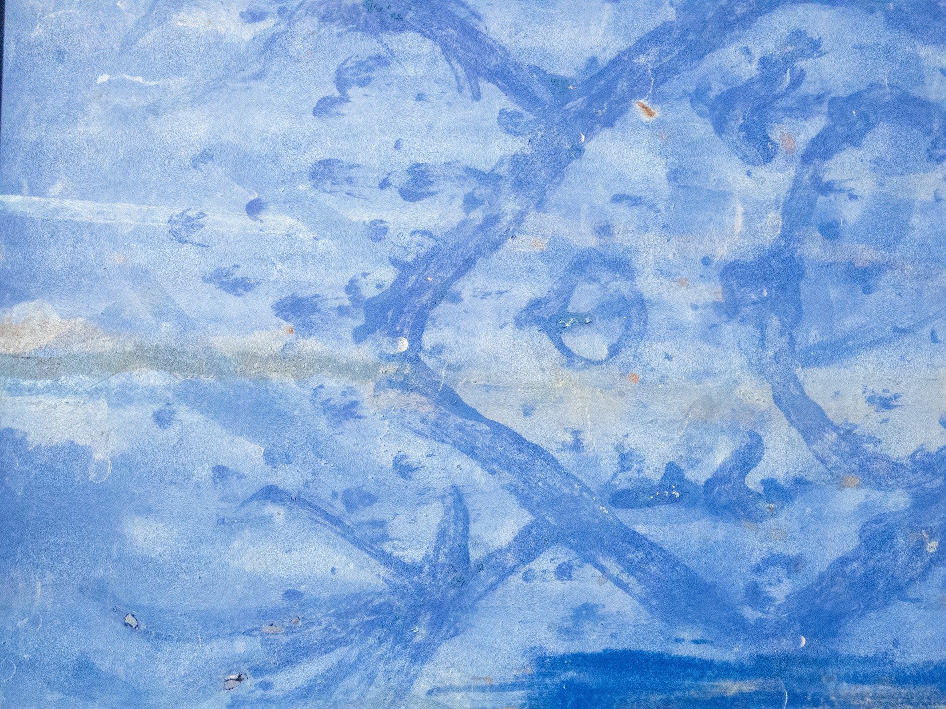 Blue sweeps on the cold, weathered paint tells of the past, metal holds the hue