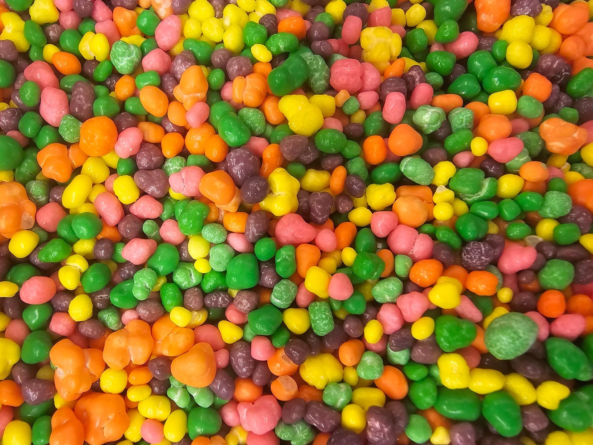 Bright pebbles of sweet, rainbow hues in every bite, sugary mountain