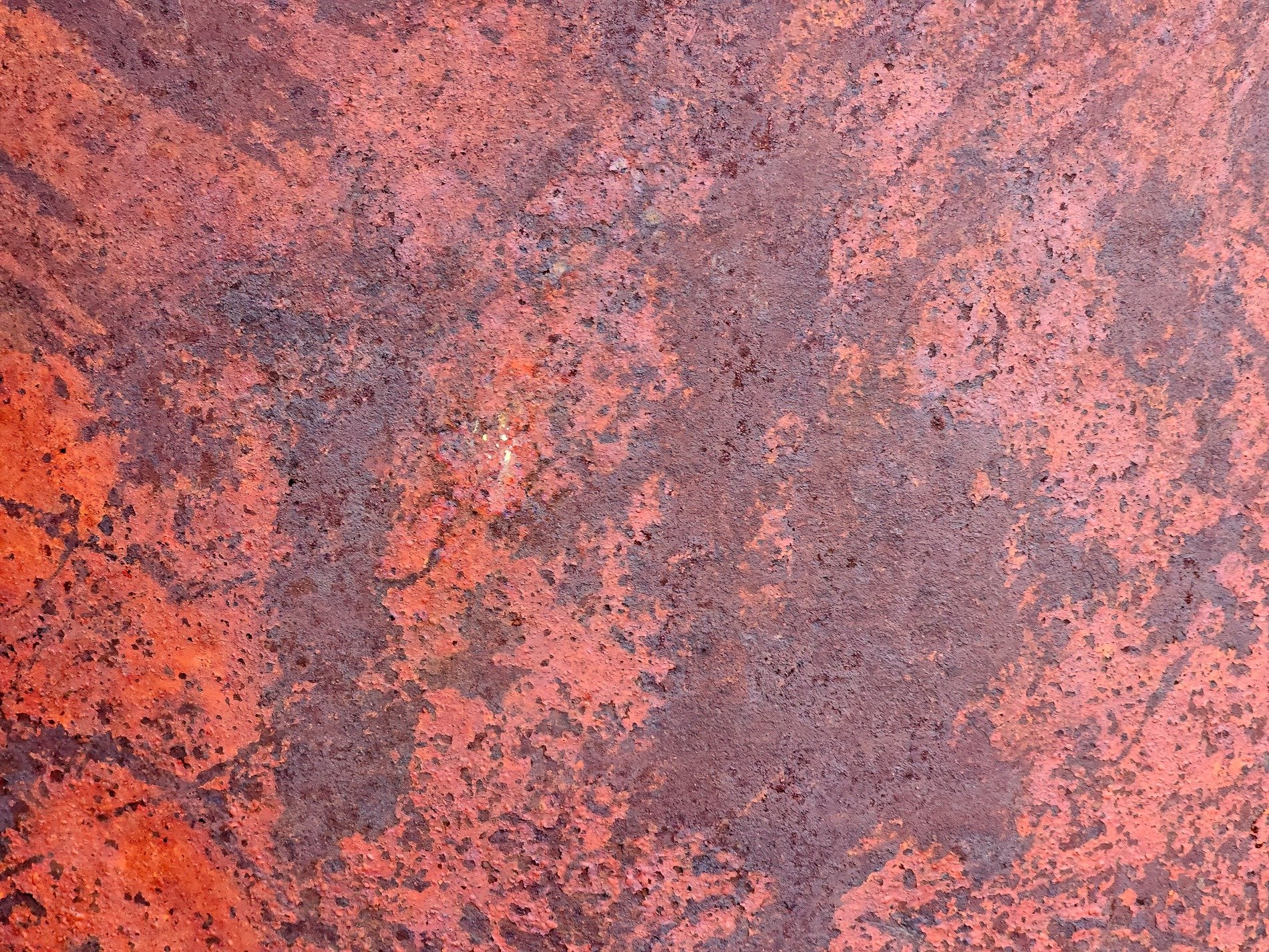 Burnt orange decay, iron skin turns into dust, time wears down the steel