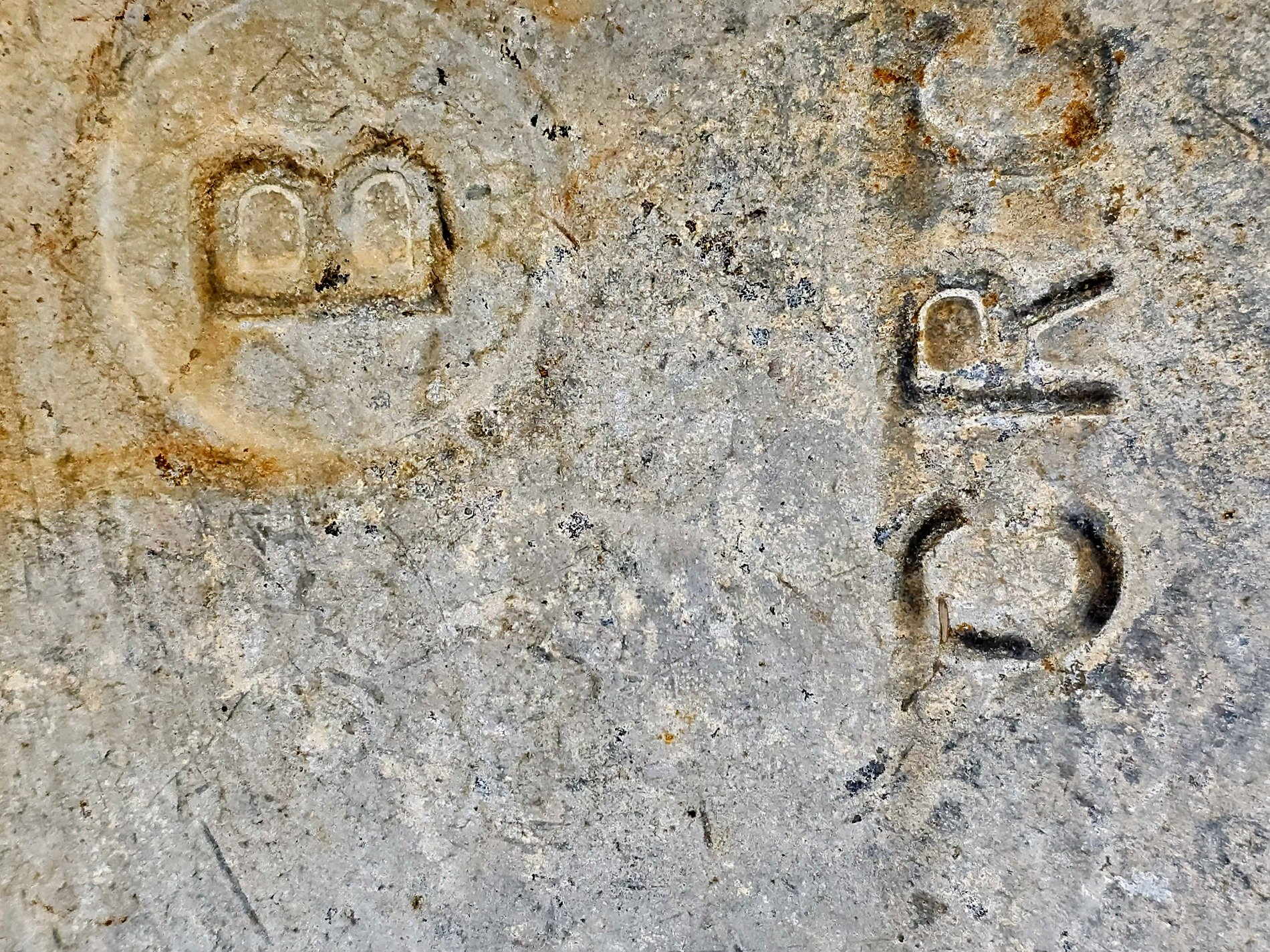 Cast skin turns to grit, jagged pits mark the metal, old paths show the way