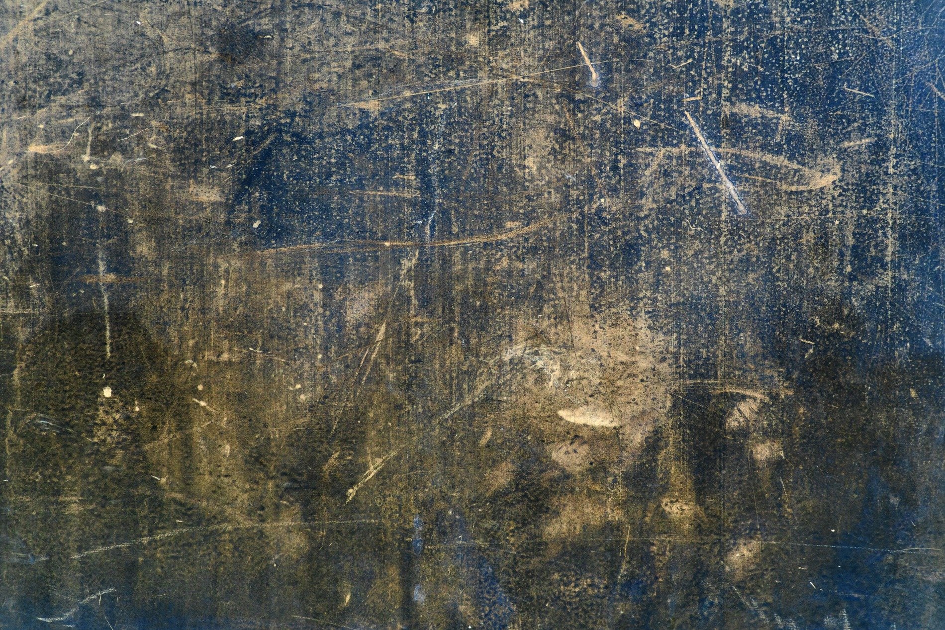 Dark fields meet the grey, jagged lines trace the surface, light marks the finish