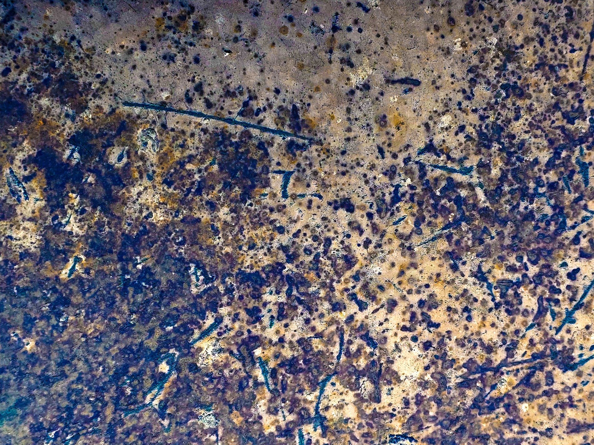 Dark fields meet the light, jagged spots scatter on top, grit holds the finish