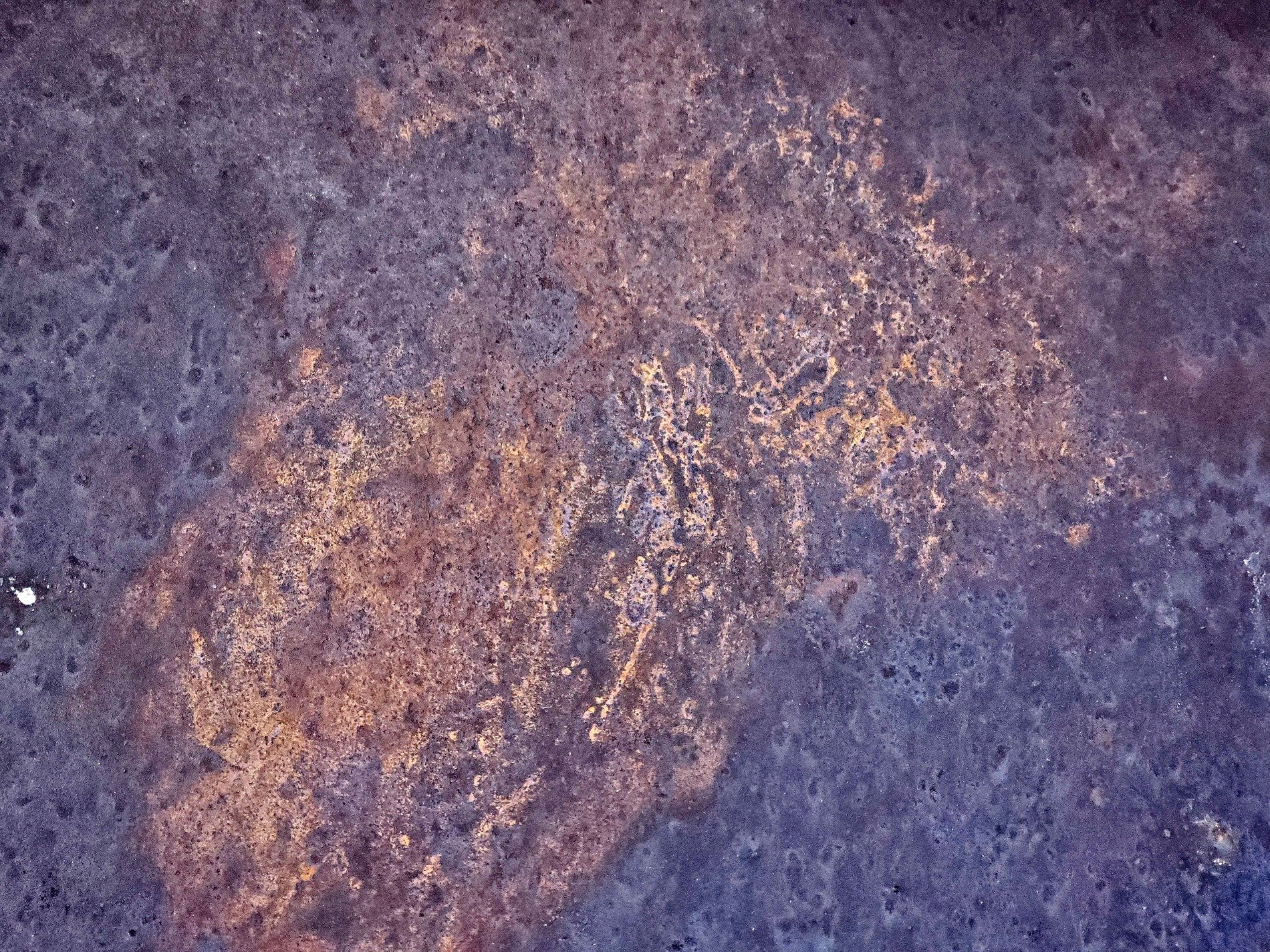 Dark fields meet the rust, orange mist holds the surface, grit claims the heavy