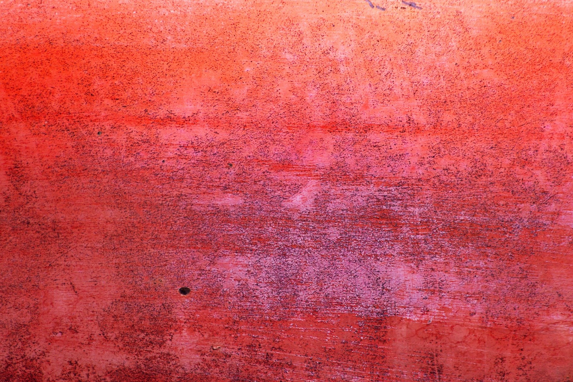 Dark grains flow in lines, vertical texture holds light, time wears the metal