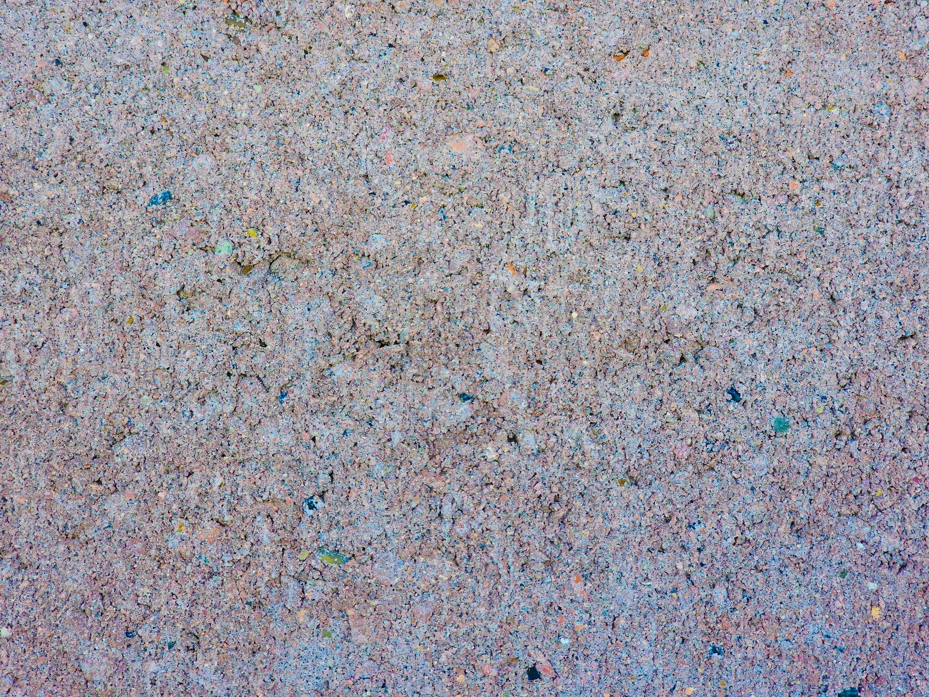 Dark grains flow through deep, jagged patterns meet the grey, grit holds the finish