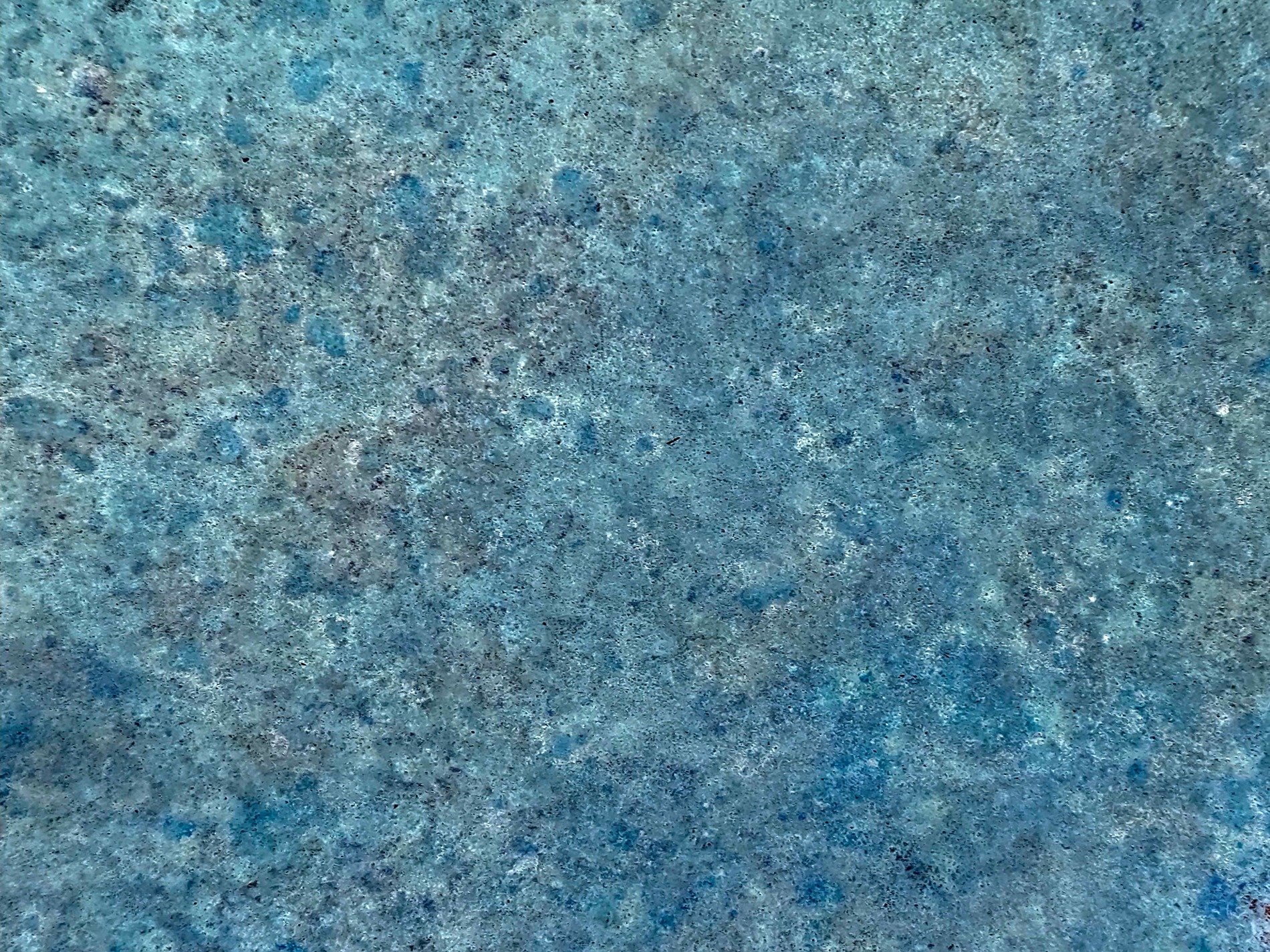 Dark waves flow thick, heavy grit claims the stone, years leave a deep mark