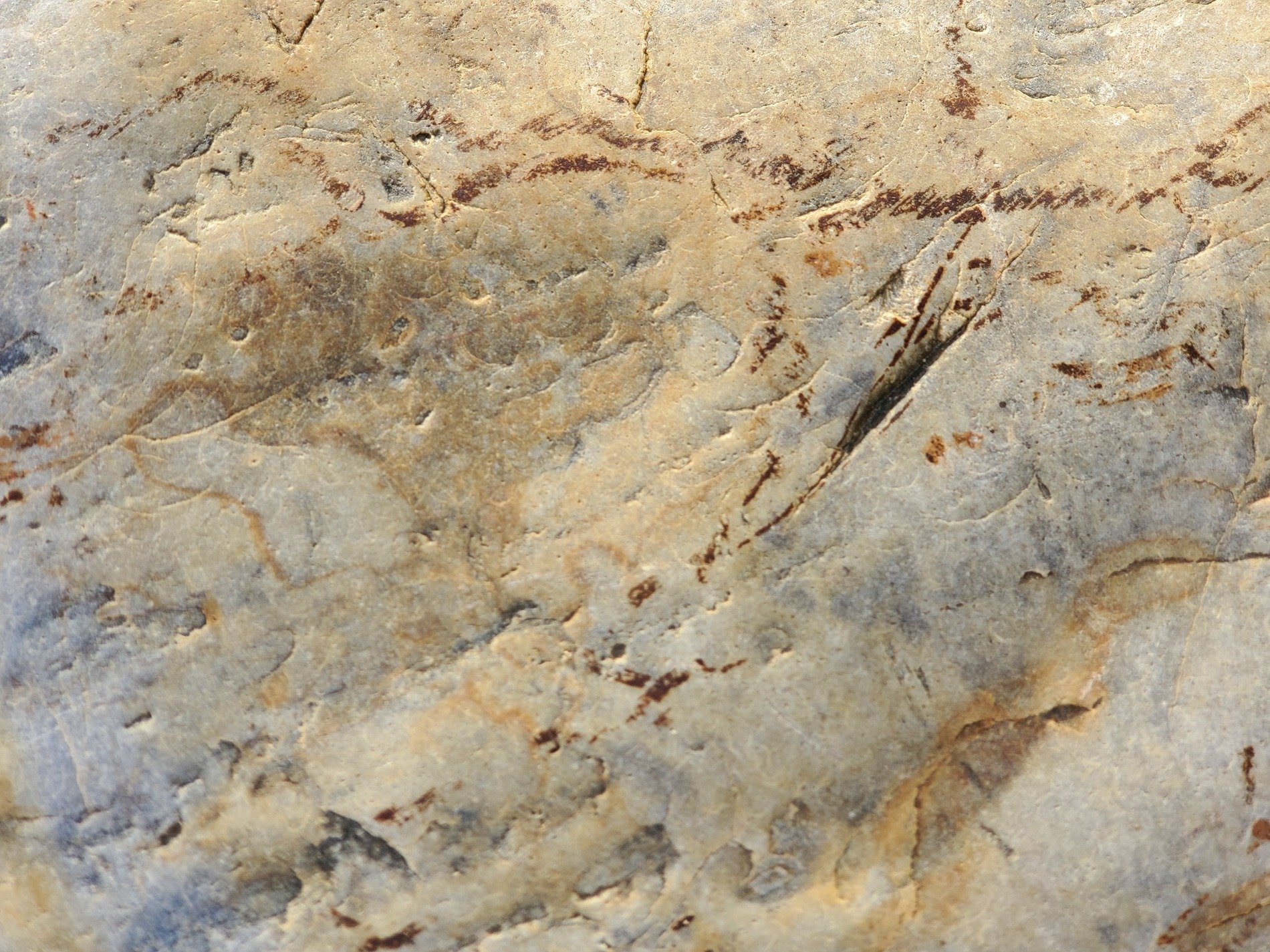 Earthy veins of red, ancient stone wears many cracks, time reveals the grain