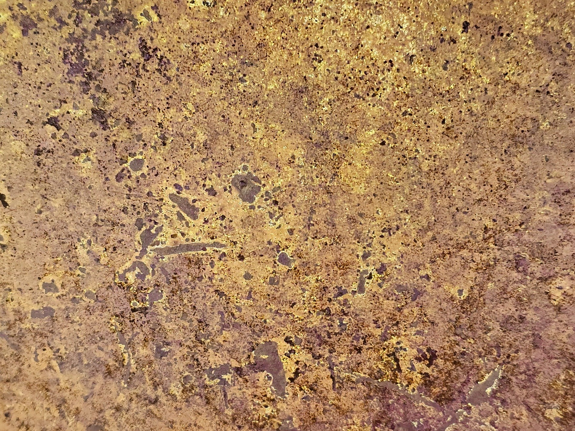 Gold mist holds the field, mottled grit claims the heavy metal, light carves the skin