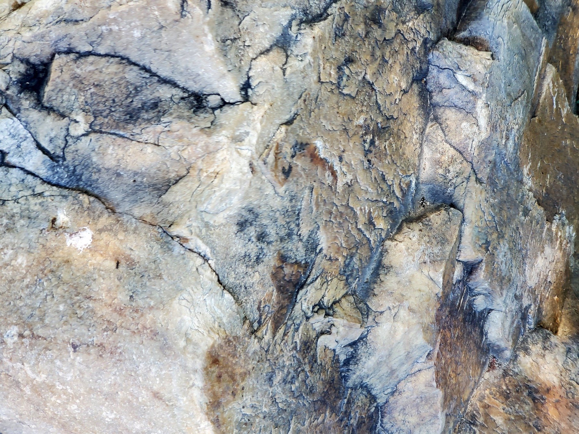 Grey paths meet the light, dark veins trace the heavy stone, grit marks the finish