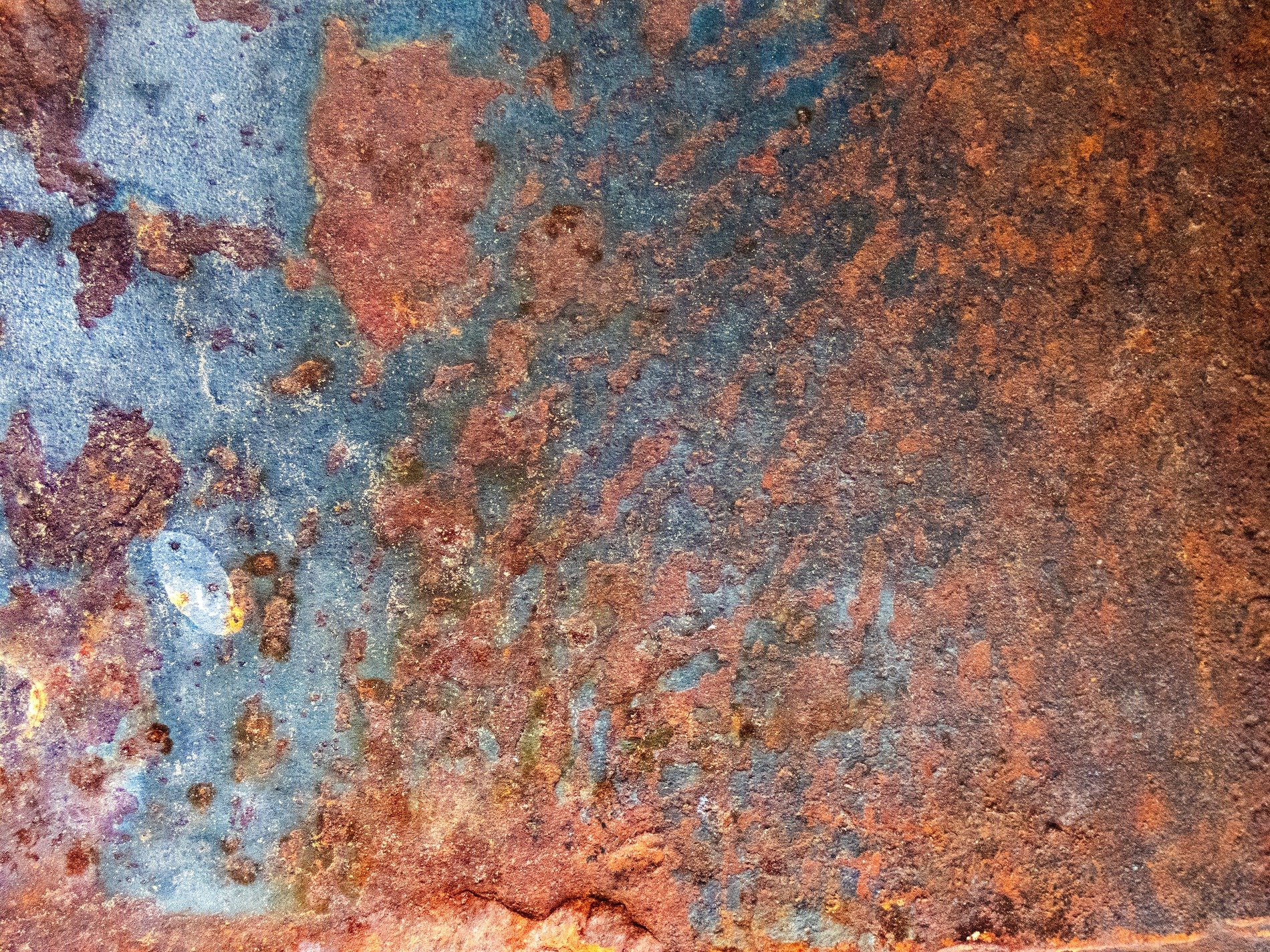 Grey skin has dark paths, vertical marks trace the field, grit marks the finish