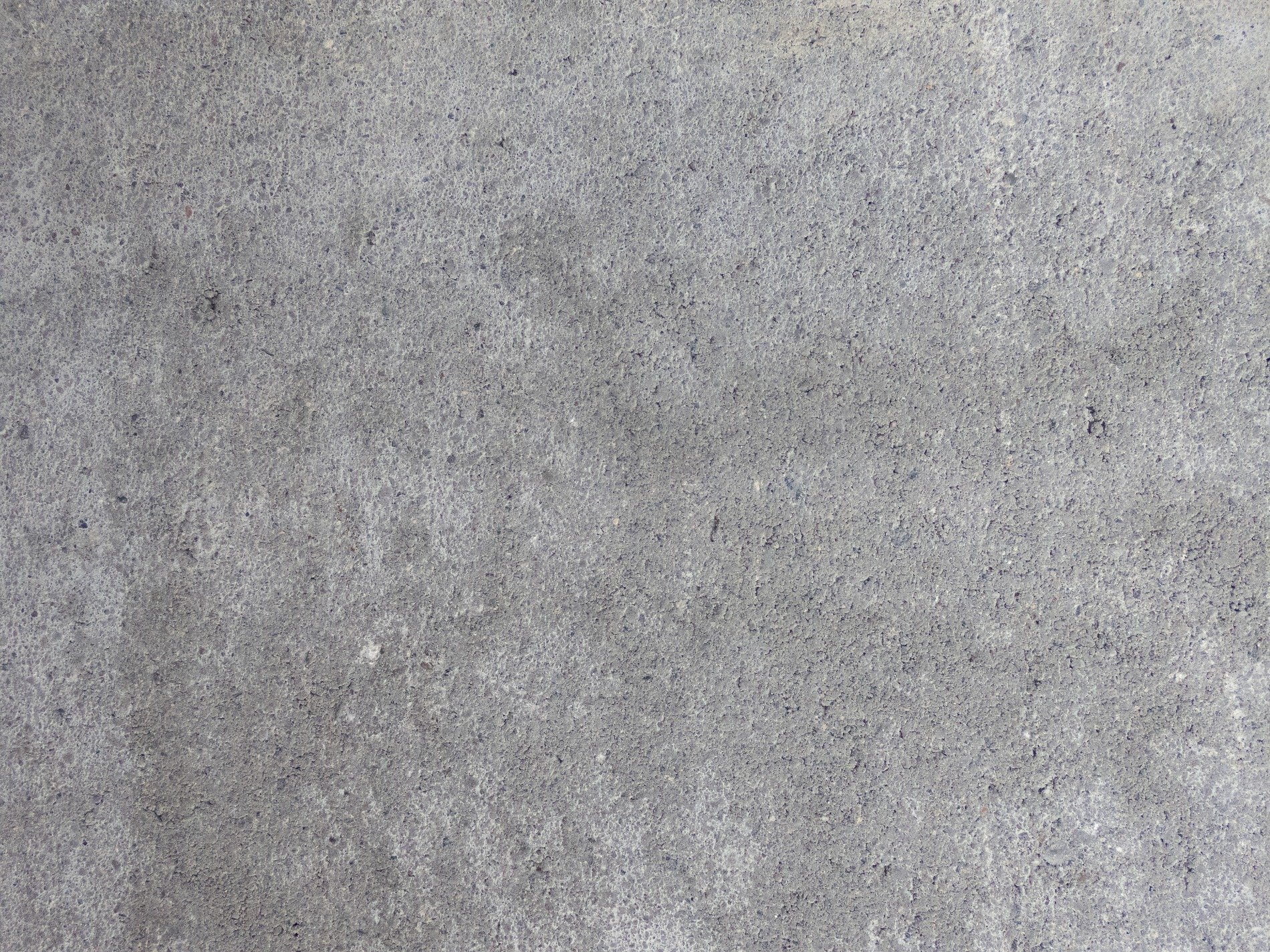 Grey stone meets the light, rough grains of dust and gravel, solid ground remains