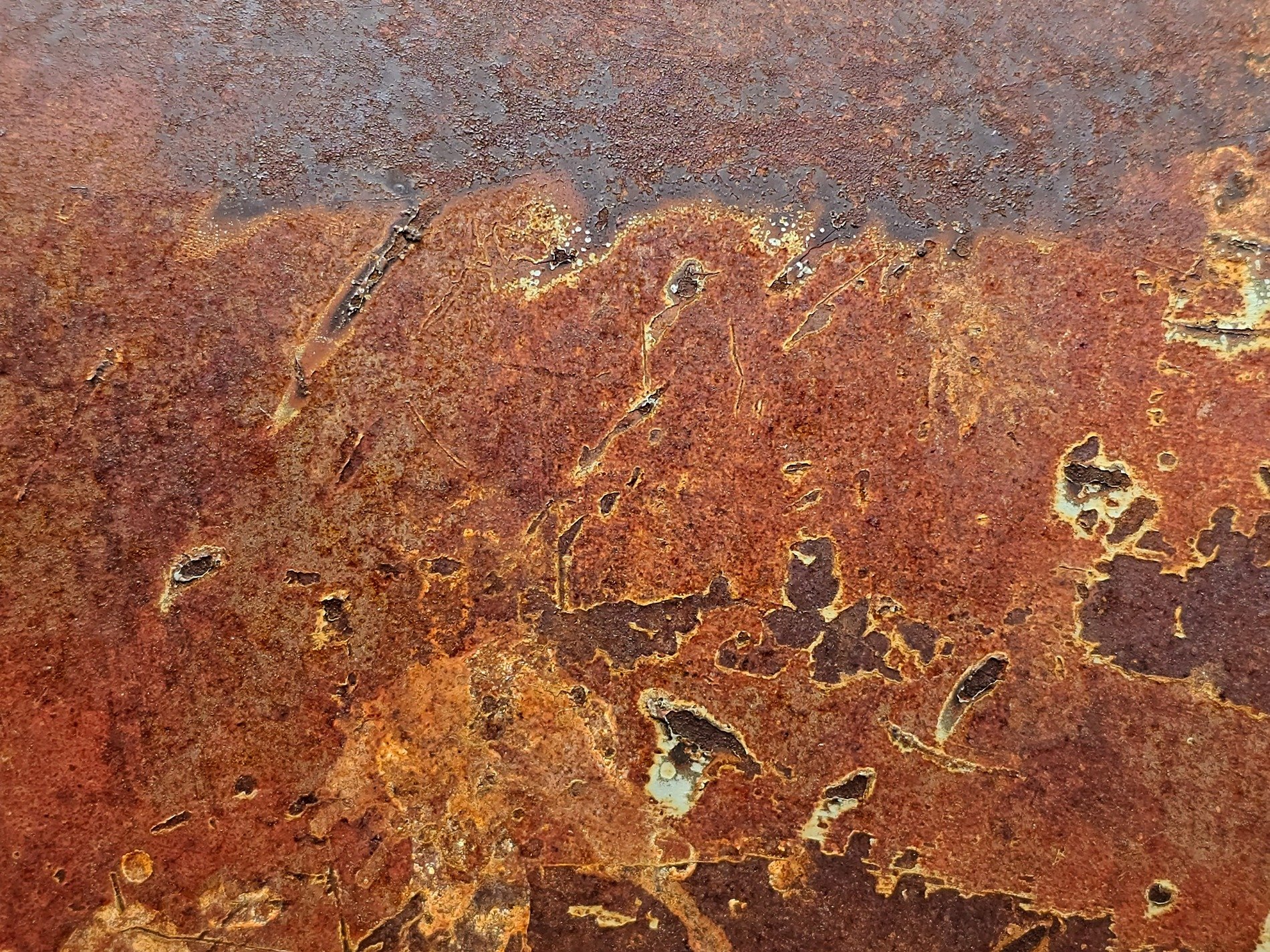 Iron turns to dust, orange flakes of heavy scale, time erodes the steel