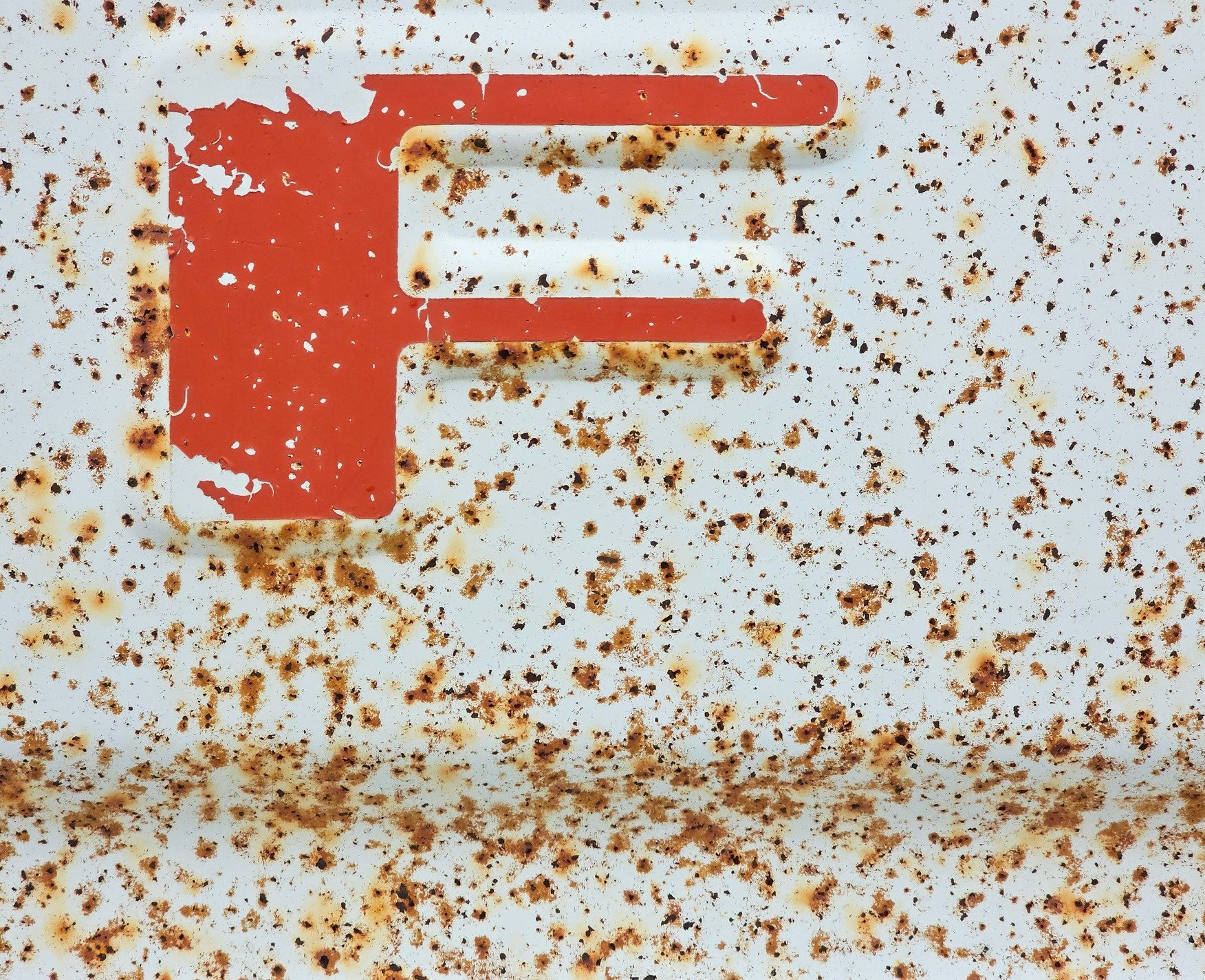 Maroon fields meet the sun, faded skin holds the surface, grit marks the finish