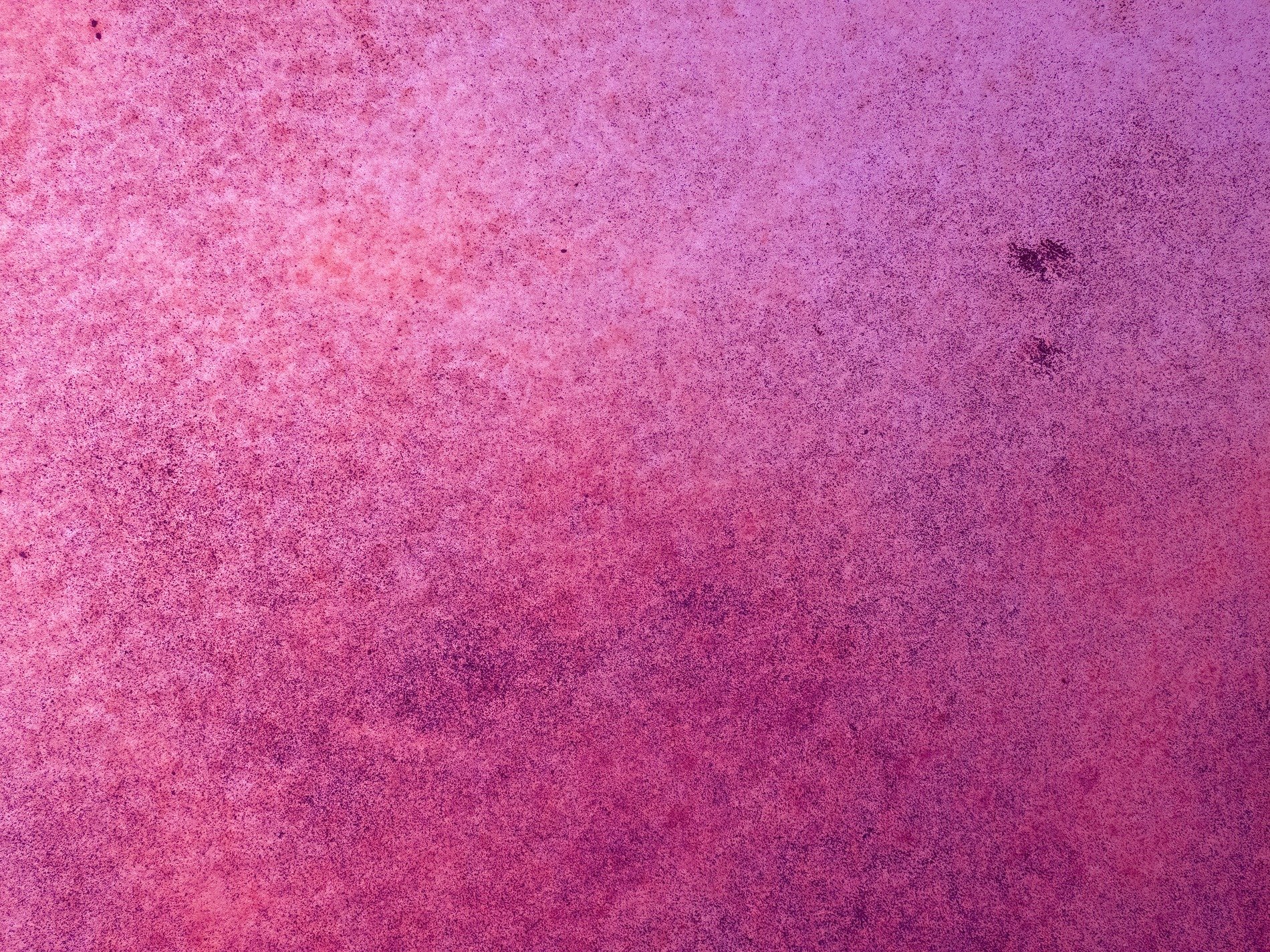 Pink dust settles deep, magenta metal ages, surface starts to fade