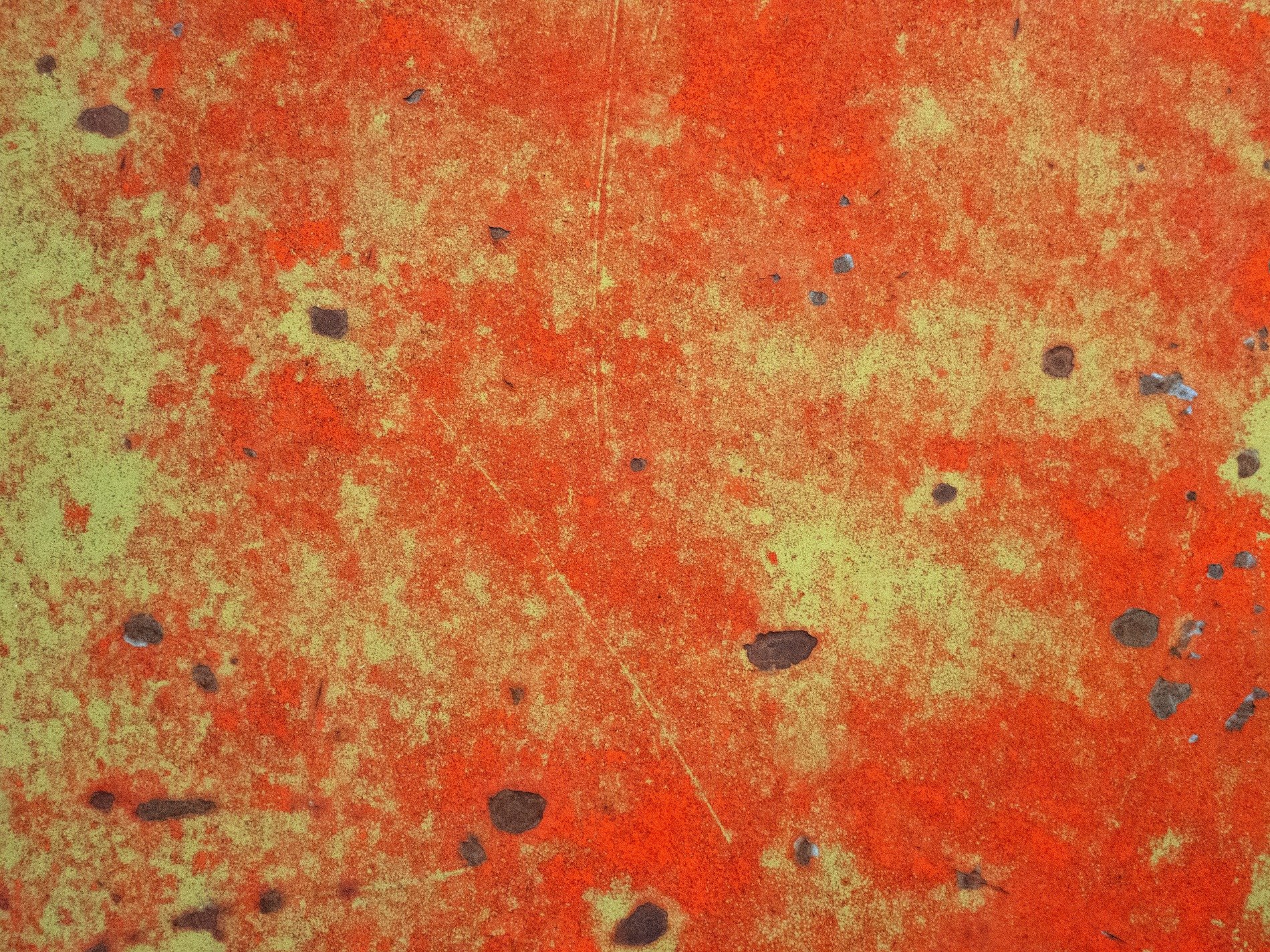 Orange fields meet the rust, heavy grit claims the surface, years leave a deep trace