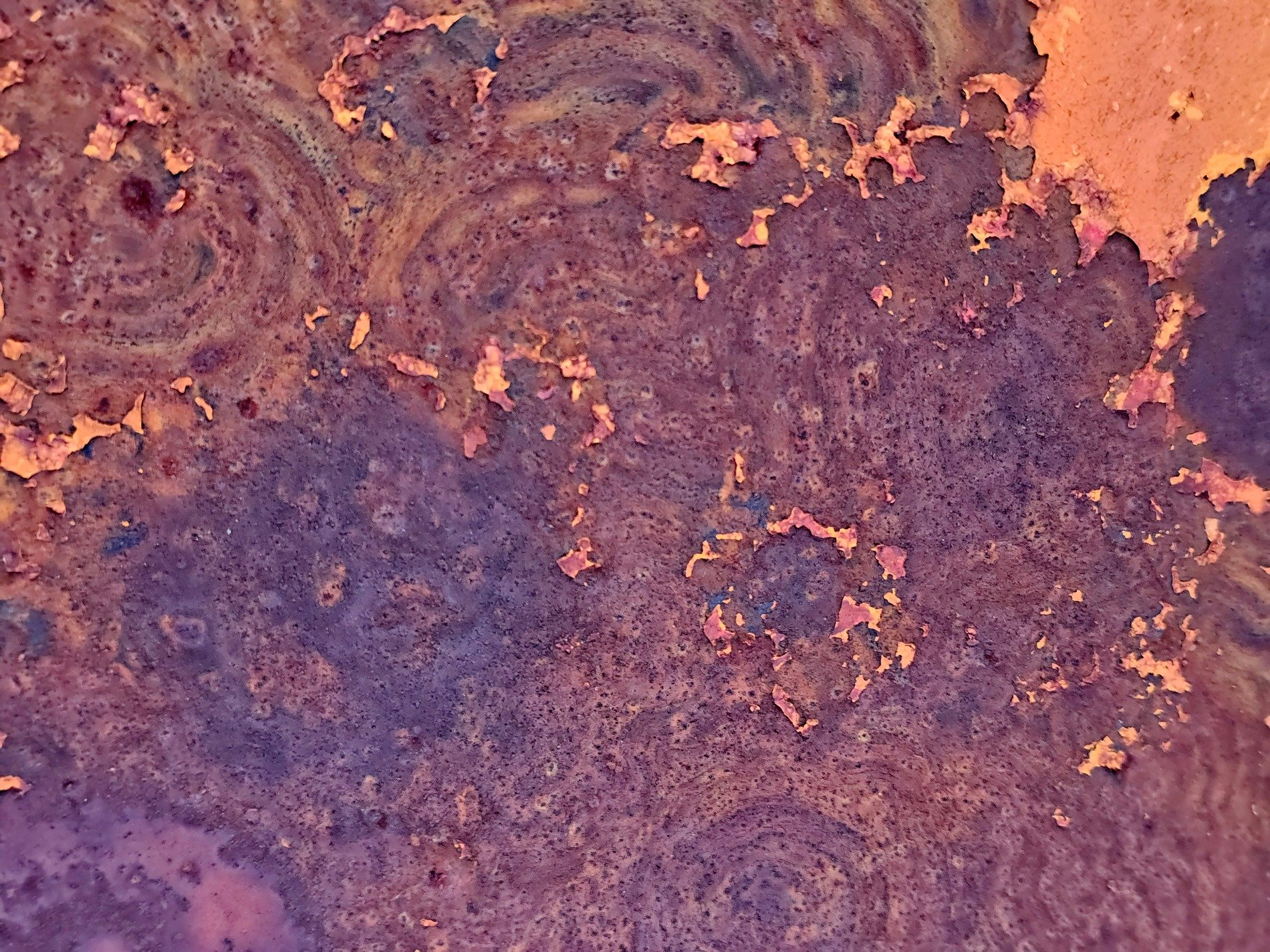 Orange grit claims the light, heavy paths trace the surface, years leave a deep trace