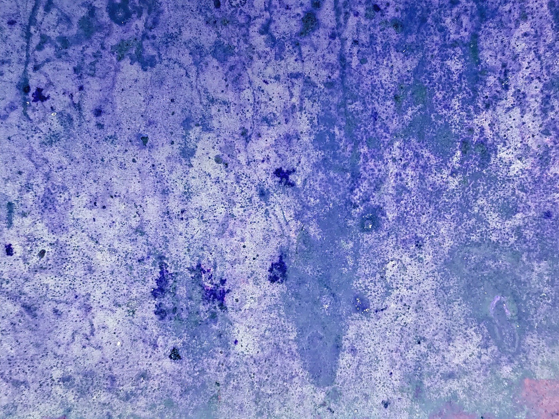 Orange strips lift up, mottled grey meets the light, grit marks the metal finish