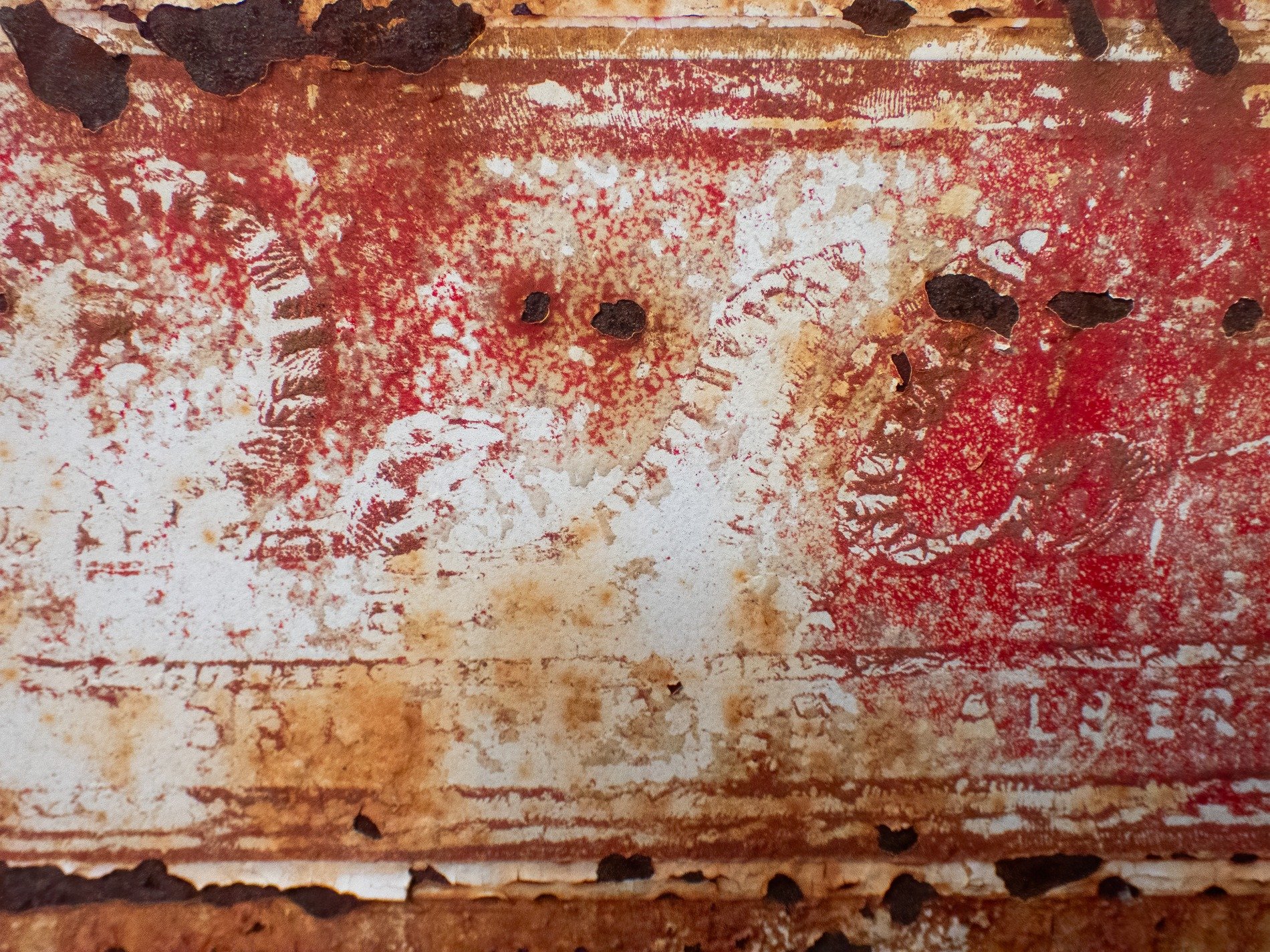 Orange waves crust thick, heavy grit claims the skin, years leave a deep mark