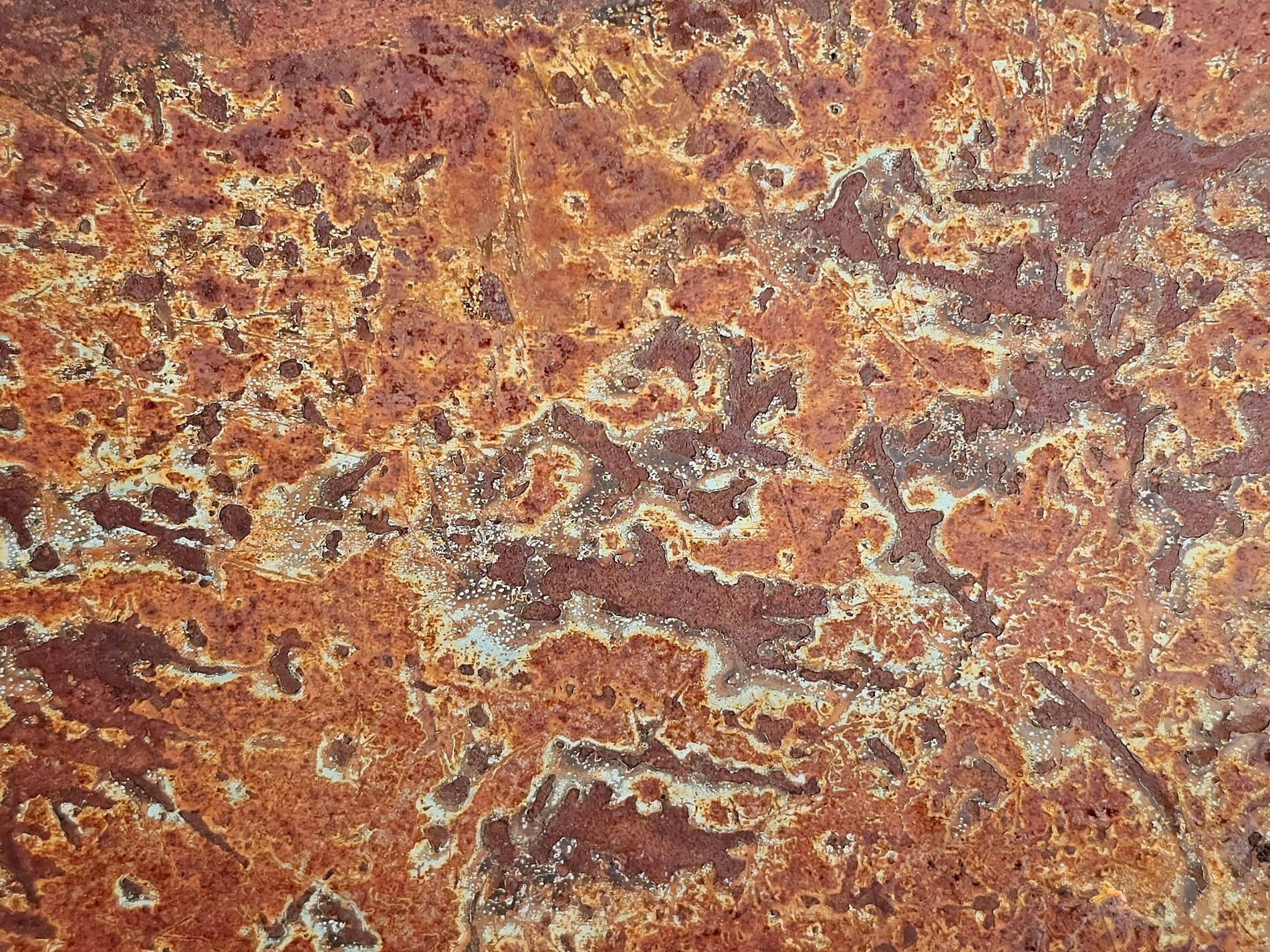 Orange waves flow thick, heavy grit claims the skin, time leaves a deep mark