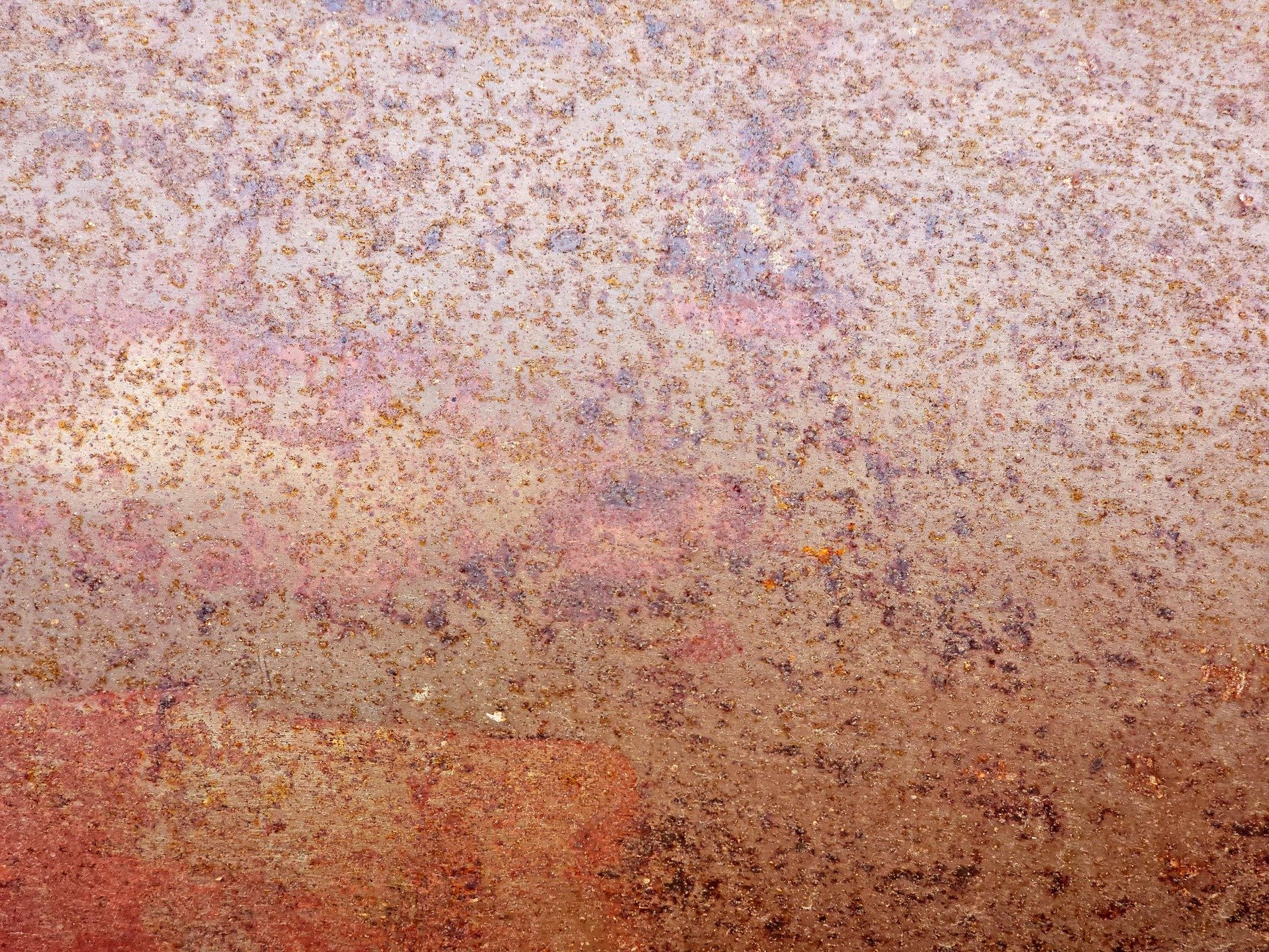 Pink mist holds the field, orange grit claims the metal, years leave a deep trace