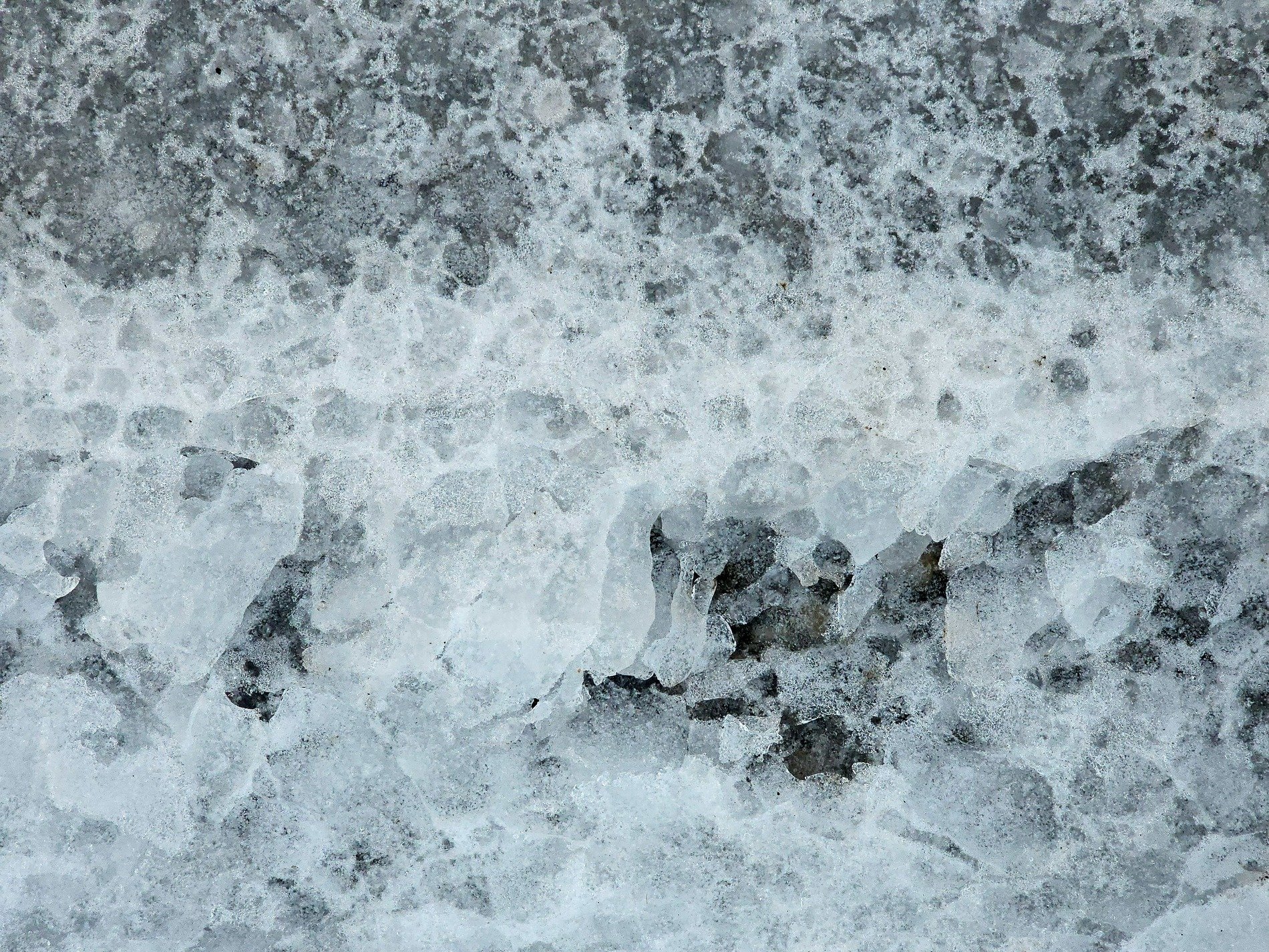 Pink tags meet the grey, jagged lines trace the concrete, art stays in the stone