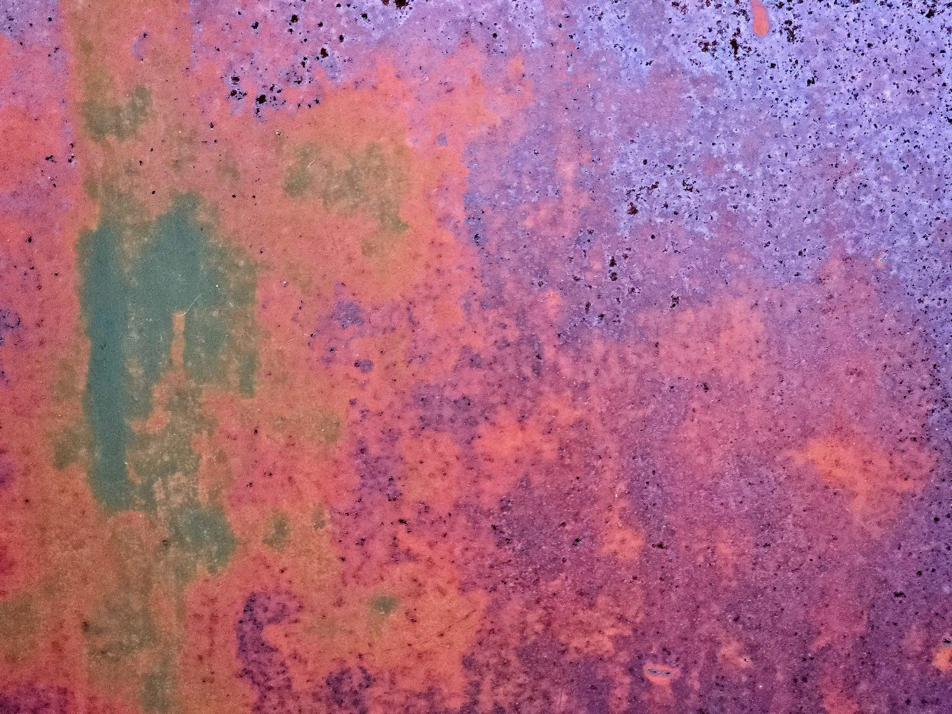 Purple fields meet rust, red patches mark the heavy, green trails trace the edge