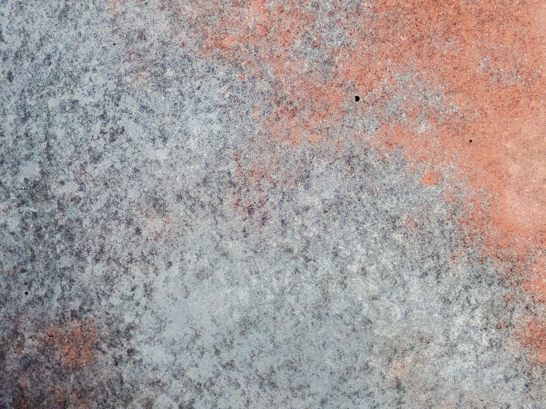 Red fields meet the blue, mottled skin holds the surface, grit marks the finish